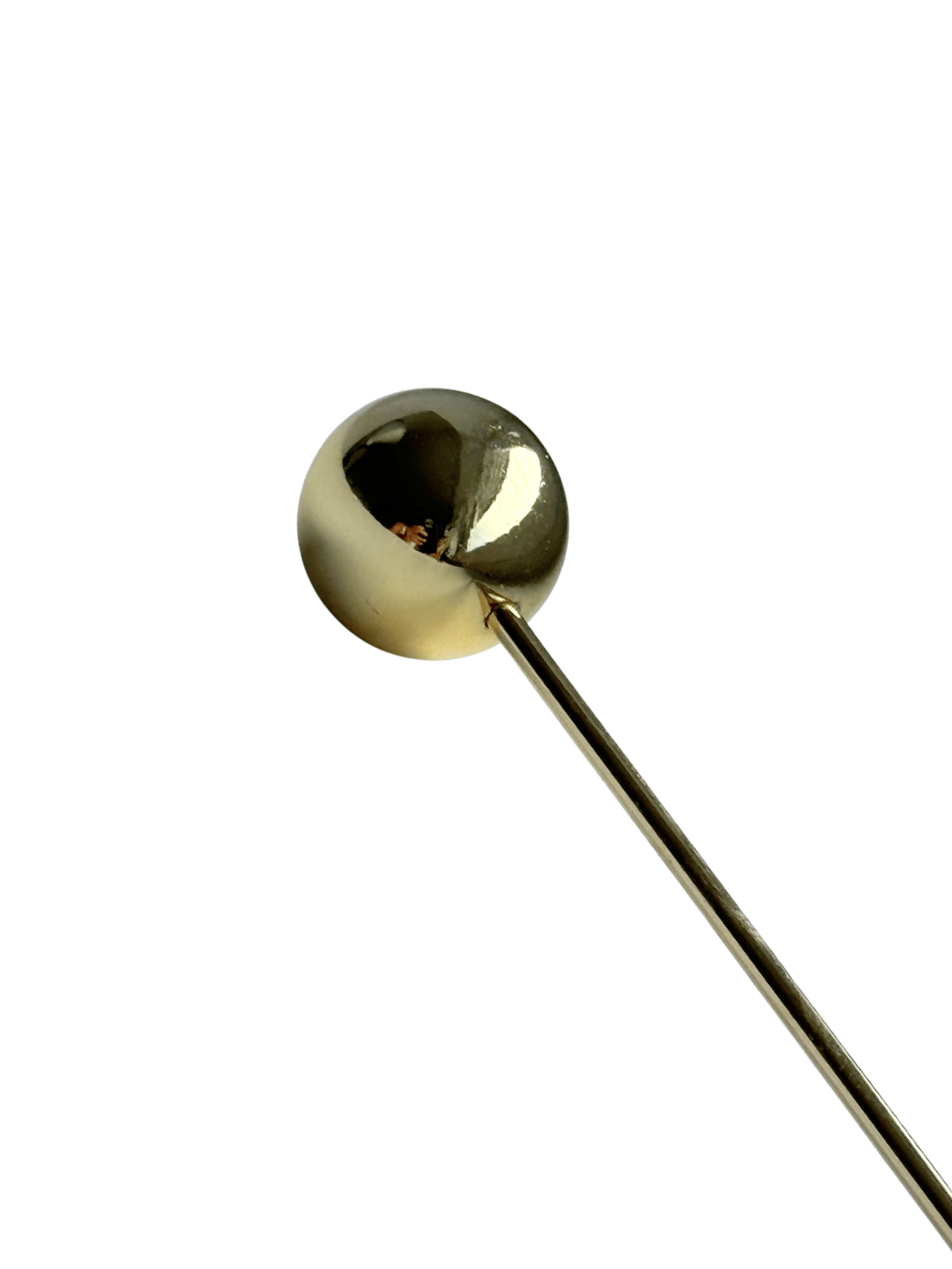 Goldfarbene Haarnadel in Kugelform
